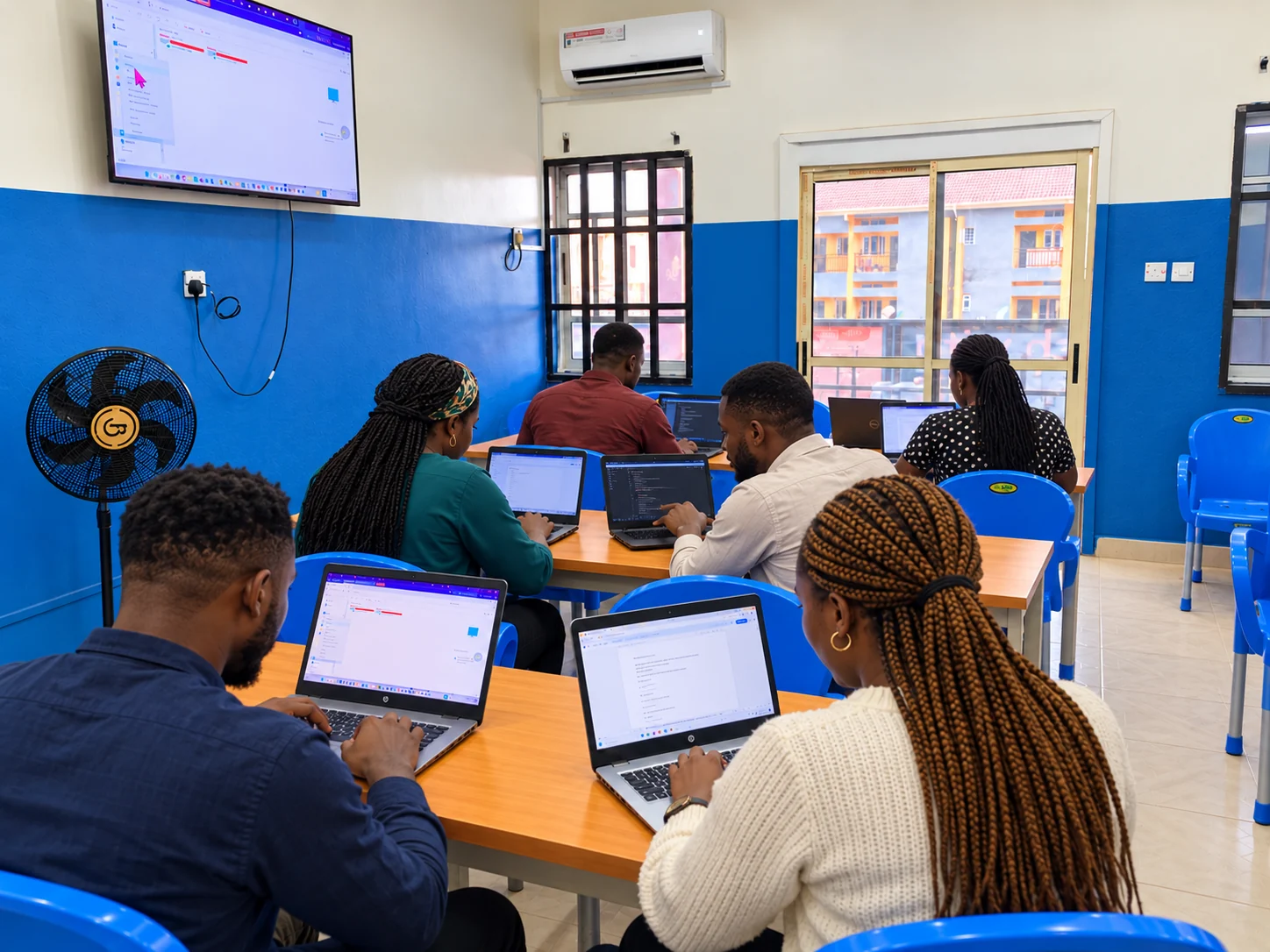 Illustrative learning scene with digitally added people in the TWA classroom